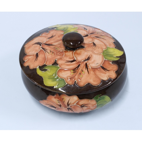 70 - Moorcroft hibiscus jar and cover, 13cm diameter