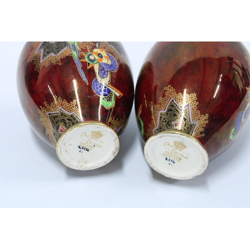 79 - A pair of Crown Devon red lustre vases, painted with parrots in pattern 2114, 13cm  (2)