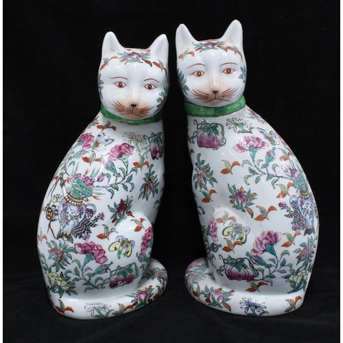 85 - A pair of Famille rose cats, 27cm (2)