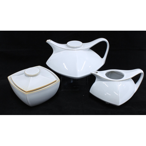 94 - Montgolfier, France three piece teaset with teapot, cream jug and sugar bowl, white glazed and of mo... 