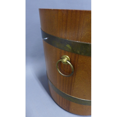 273 - Teak and brass bound barrel with cover, by Drummond Woodware, Scotland,  34 x 35cm