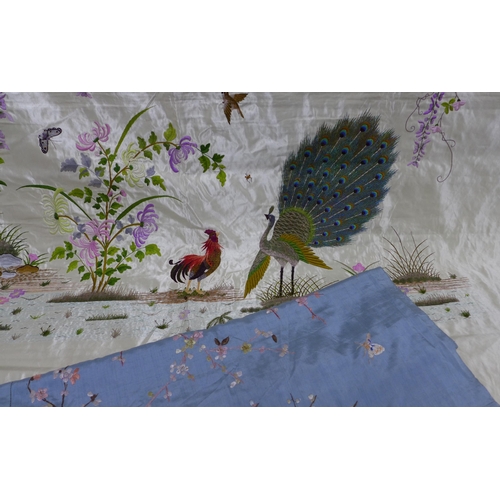 300 - An embroidered silk panel with peacocks and foliage, 150 x 140cm  together with a blue embroidered p... 