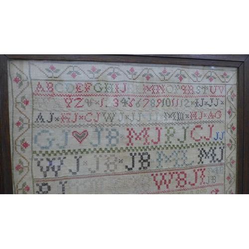 469 - 19th century alphabet needlework sampler, worked by Mary Johnston, Aged 10, framed under glass, size... 