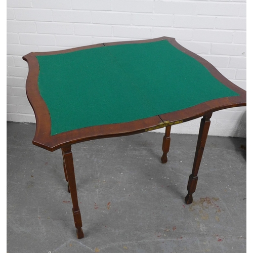 280 - Mahogany fold over card table with serpentine top and green baize interior, on tapering legs, 75 x 7... 