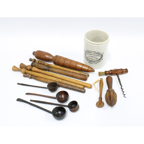 106 - A collection of 19th century and later treen kitchenalia to include a pastry cutter, spoons and scoo... 