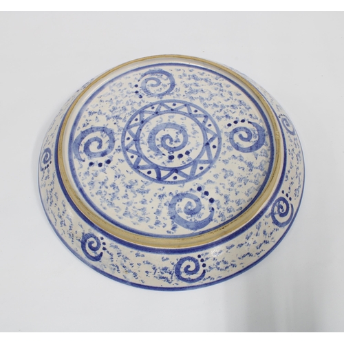 109 - Studio pottery blue and white circular shallow dish with spongeware pattern and central star motif, ... 