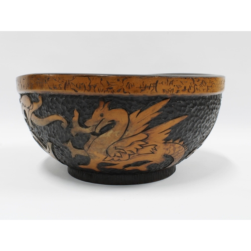 111 - Early 20th century Dragon pokerwork fruit bowl, 30cm diameter