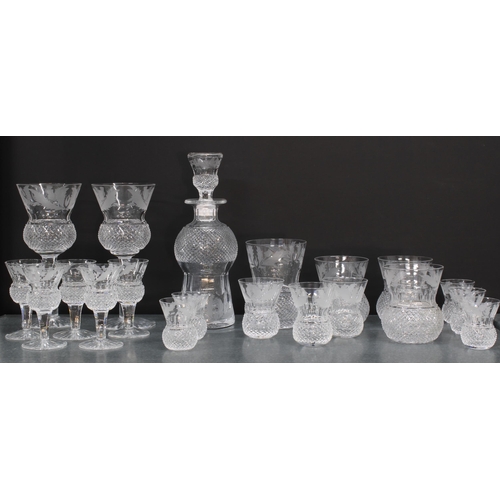 124 - A part suite of Edinburgh Crystal thistle patterned glass to include a small decanter and stopper, 2... 