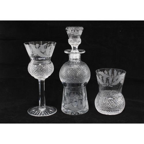 124 - A part suite of Edinburgh Crystal thistle patterned glass to include a small decanter and stopper, 2... 