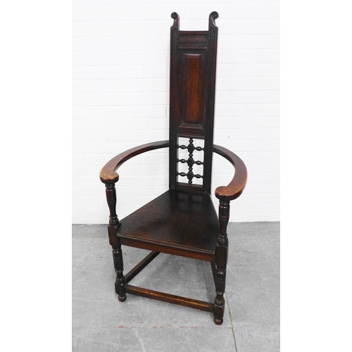 290 - Manner of Liberty & Co, London oak Shakespeare chair, with a panelled and pierced back,  triangular ... 