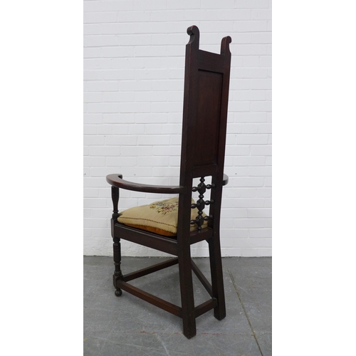 290 - Manner of Liberty & Co, London oak Shakespeare chair, with a panelled and pierced back,  triangular ... 