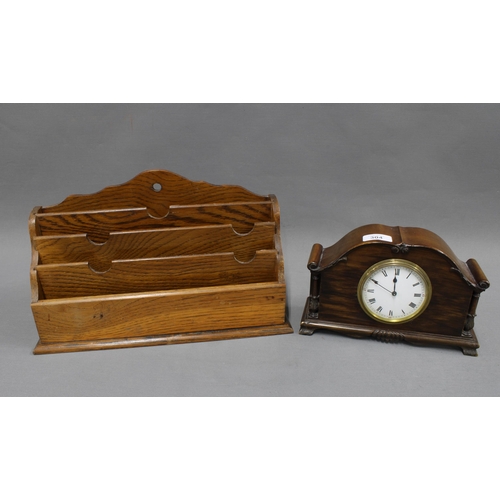 304 - Mahogany mantle clock together with an oak newspaper rack. 23 x 35cm. (2)