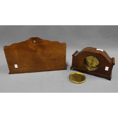 304 - Mahogany mantle clock together with an oak newspaper rack. 23 x 35cm. (2)