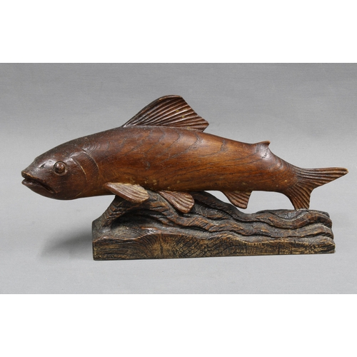 311 - Carved wooden fish figure. 40cm wide.