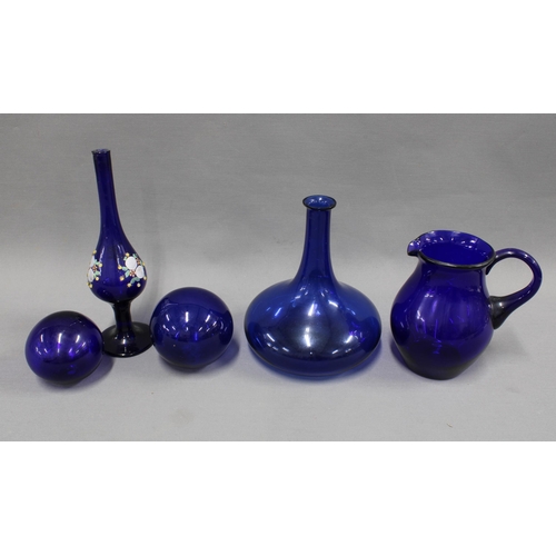 324 - A collection of Bristol blue glass to include a jug, flat bottomed bottle, two glass witches balls a... 