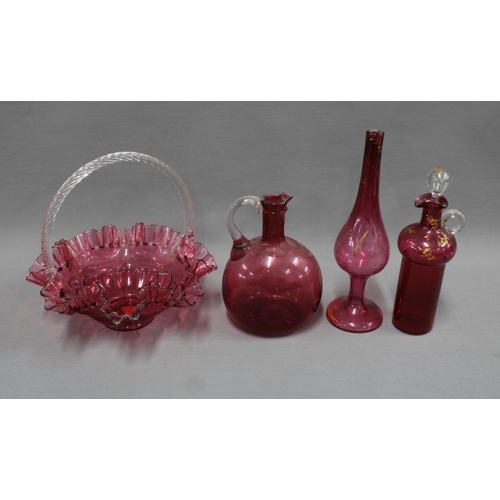 326 - A collection of cranberry glass to include a posy basket, decanter and stopper, vase, etc, tallest 2... 