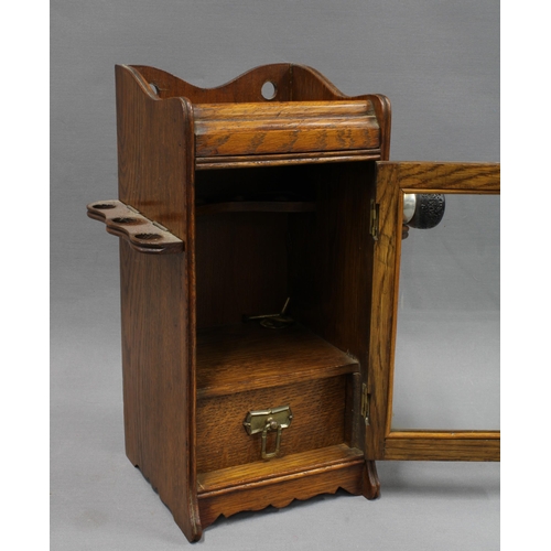 337 - An Edwardian oak and glass pipe cabinet, 32cm,  together with a collection of briar pipes to include... 