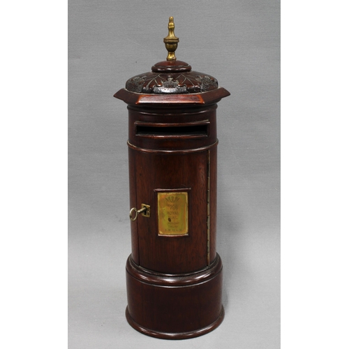 340 - 20th century stained mahogany table top post box, cylindrical form with domed top having acorn patte... 