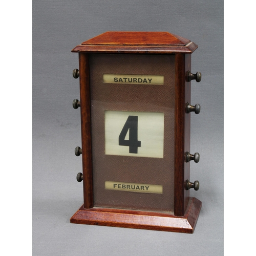 341 - Mahogany cased perpetual desk calendar with glazed panel and operating nozzles on sides, 22cm