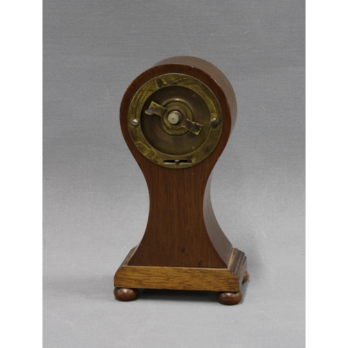 342 - Mahogany and inlaid clock of small proportions, with Arabic numerals and raised on bun feet, 16cm