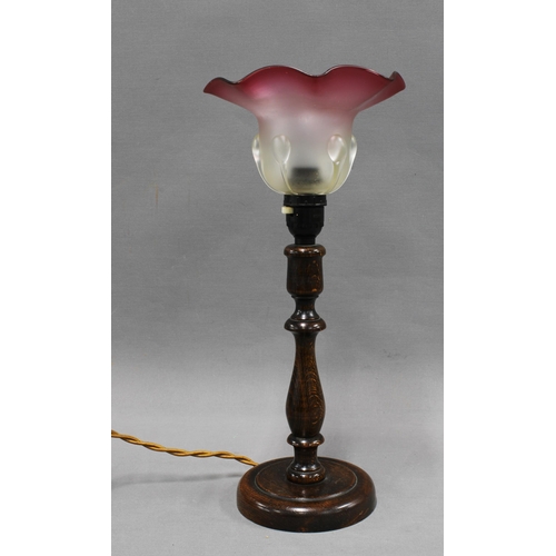 346 - Oak table lamp base with frilled shade in opaque and cranberry glass,  39cm including shade