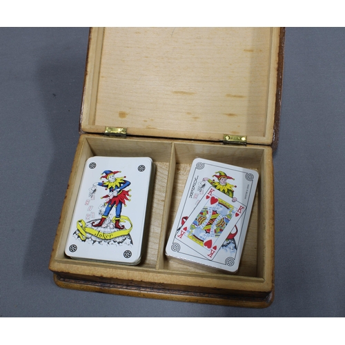 347 - Pokerwork card box containing a set of cards, a pokerwork playing cards box with cards, 18 x 13cm,  ... 