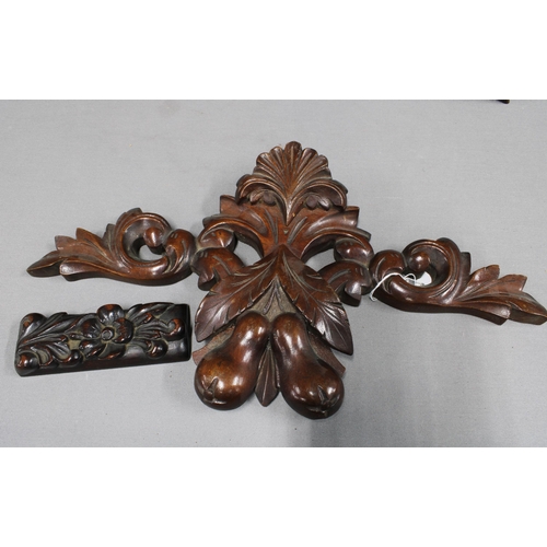 349 - A pair of bird carved oak wall plaques, mahogany fruit and leaf pelmet, 44cm wide,  and a small maho... 