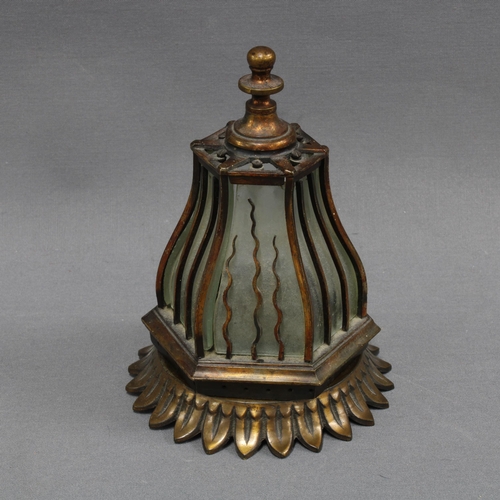 364 - Bronze patinated metal nightlight of hexagonal form, the lantern top with glass panels, on a circula... 