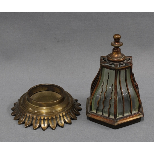 364 - Bronze patinated metal nightlight of hexagonal form, the lantern top with glass panels, on a circula... 