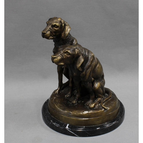 368 - Bronze study of two dogs raised  on a polished black hardstone base, apparently unsigned  27cm high