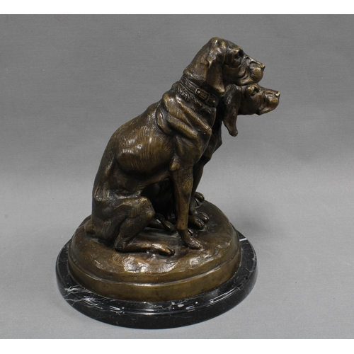 368 - Bronze study of two dogs raised  on a polished black hardstone base, apparently unsigned  27cm high