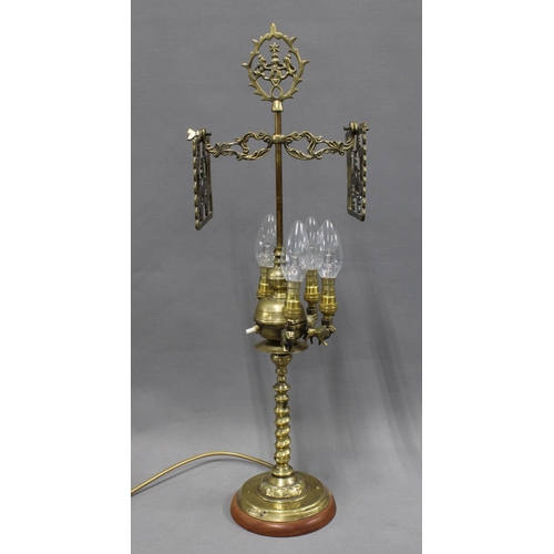 369 - Brass table lamp base with four arms on lion supports, barley twist column and circular wooden base,... 