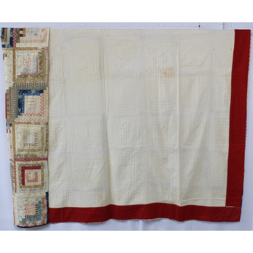 372 - 19th century American Log Cabin Patchwork Quilt, incorporating beige, blue and red panels, the under... 