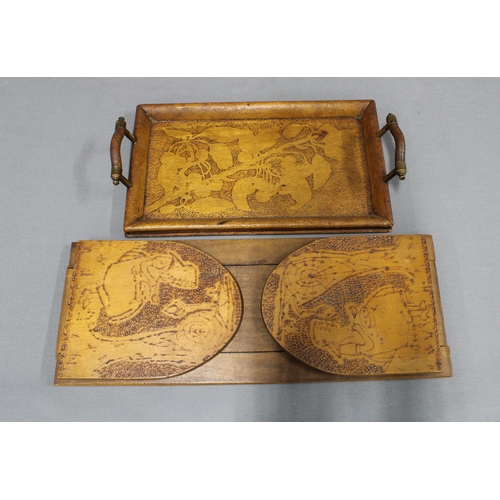 379 - Collection of pokerwork to include an Art Nouveau tray with lily pad leaves, 47cm long, a smaller tr... 