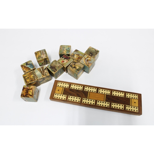 406 - Late 19th / early 20th century cribbage board and a set of building bricks with animal patterns