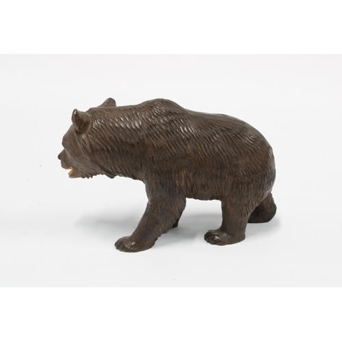 415 - Black Forest carved wood bear, modelled standing on a all fours,  10cm long