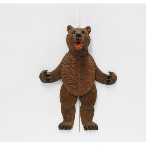 416 - Black Forest novelty carved wood bear wall plaque with open mouth and moving limbs, 21cm