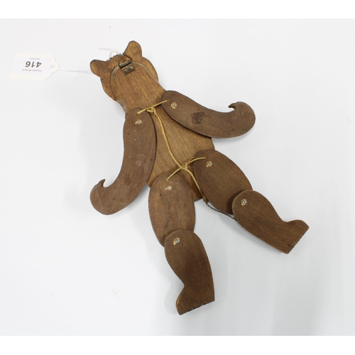 416 - Black Forest novelty carved wood bear wall plaque with open mouth and moving limbs, 21cm