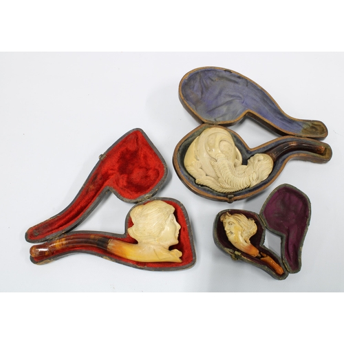 418 - Three antique Meerschaum pipes, with cases, the miniature pipe and one other with damage to amber ha... 