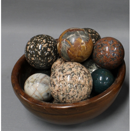 429 - Collection of hardstone carpet bowls and a wooden fruit bowl (a lot)