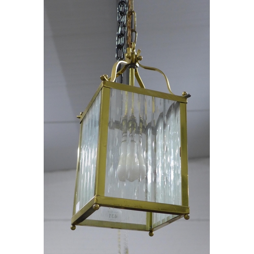 431 - Brass and glass panelled hanging lantern. 36cm.