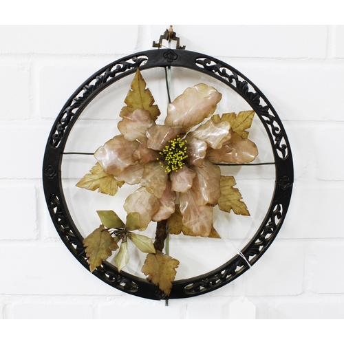 435 - Chinese rose quartz floral wall hanging in a circular stylised frame 30cm.