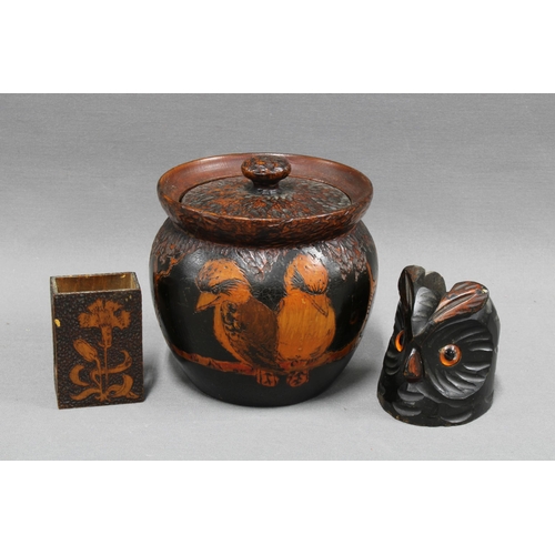 445 - Pokerwork tobacco jar together with two match box holders, one inthe form of an owl. 12cm. (3)