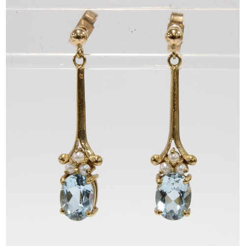 48 - A pair of 9ct gold aquamarine and pearl drop earrings with a knife edge bar suspending a group of th... 