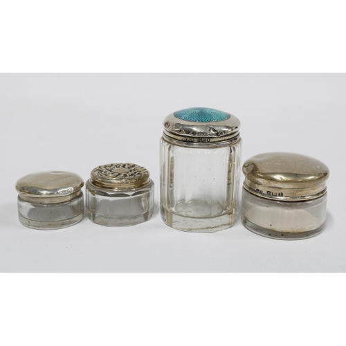 7 - A group of four silver topped glass jars, various hallmarks, tallest 5cm (4)