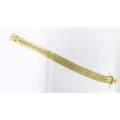 77 - Vintage 18ct gold bracelet with seven rows of textured flat links, stamped 750