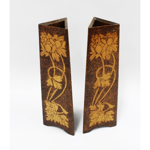 93 - A pair of Art Nouveau pokerwork vases, triangular for worked with stylised flowers, 32cm  (2)