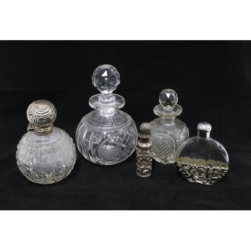 99 - Edwardian silver mounted glass scent bottle, Chester 1907, together with two cut glass scent bottles... 