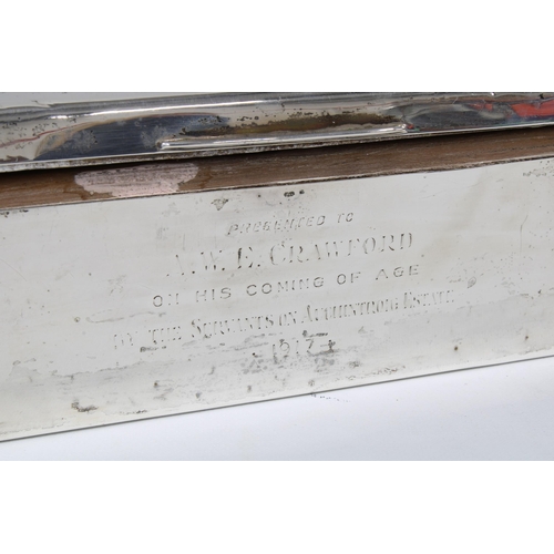 11 - Early 20th century silver table cigarette box, cedar lined and with engraved inscription, 18cm long