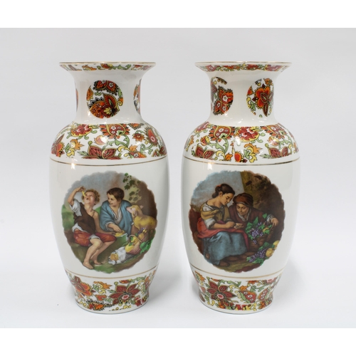 132 - Pair of porcelain vases, transfer printed pattern of children eating fruit and playing dice, 26cm  (... 